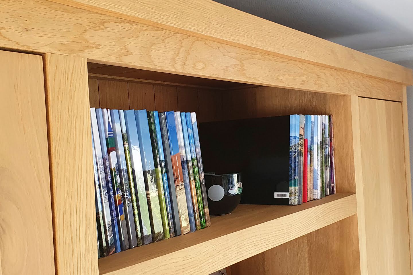 Mijn boekenkast vol met eigen gemaakte fotoboeken
